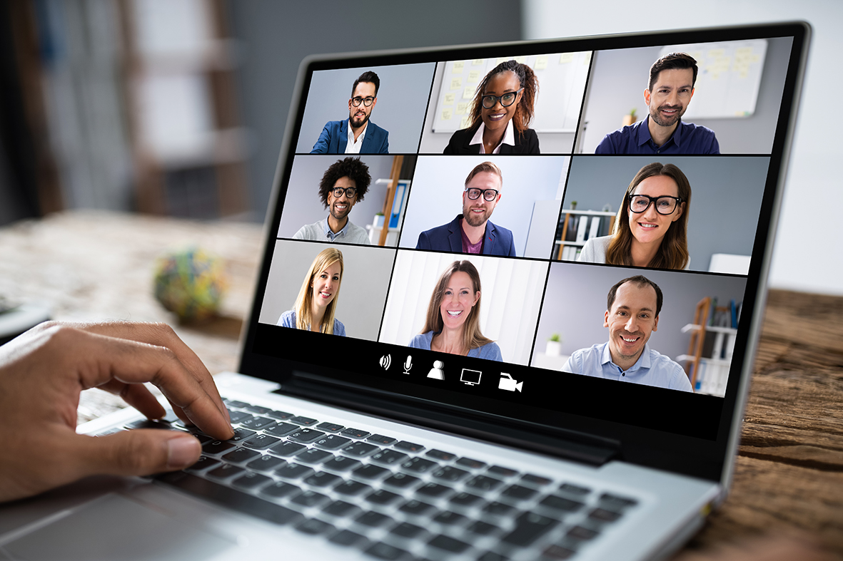 someone using a laptop to run a zoom meeting